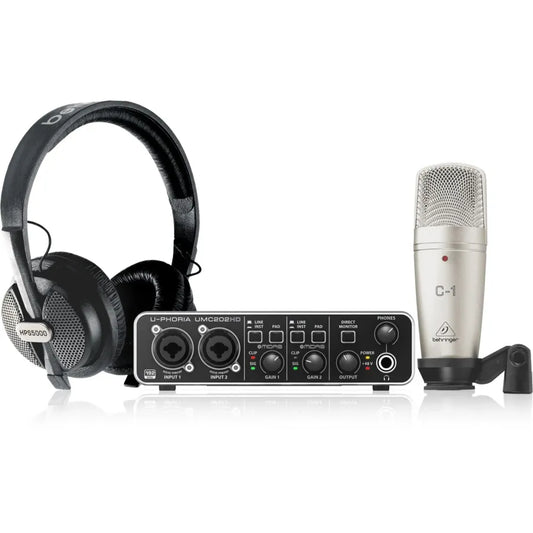 Audio equipment set with headphones, audio interface, and microphone on a white background