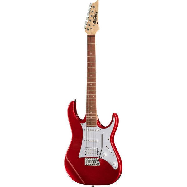 Red electric guitar on a white background