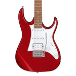Red electric guitar with a white pickguard on a white background