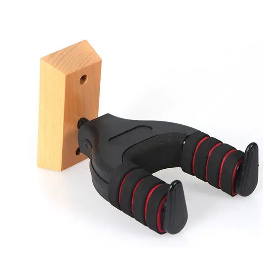 Black and red guitar wall hanger attached to a wooden block on a white background