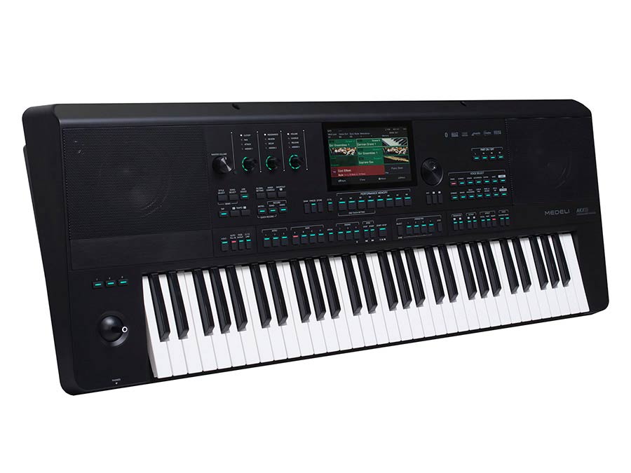 A digital workstation keyboard with a touch screen display and multiple control buttons, pedals, and knobs.