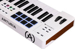 Arturia keyboard controller with black and blue keys on a white background