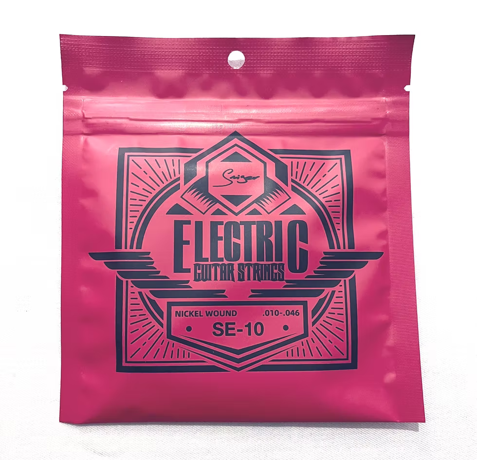 Pink packaging of electric guitar strings with black text on a white background