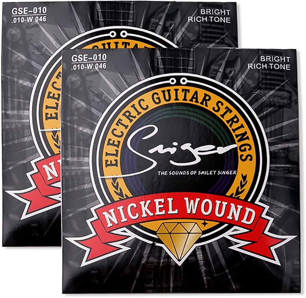 Two packages of Singer electric guitar strings with a black and red design.