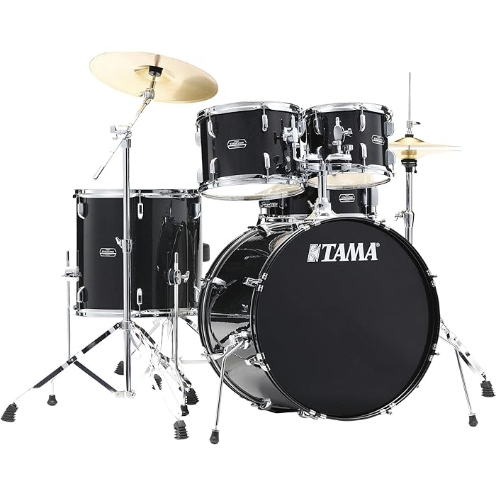 A Tama Stagestar 5-piece complete drum set with a glossy black finish, including various sized drums, a snare drum, and a bass drum, set up on stands with drumsticks and cymbals.