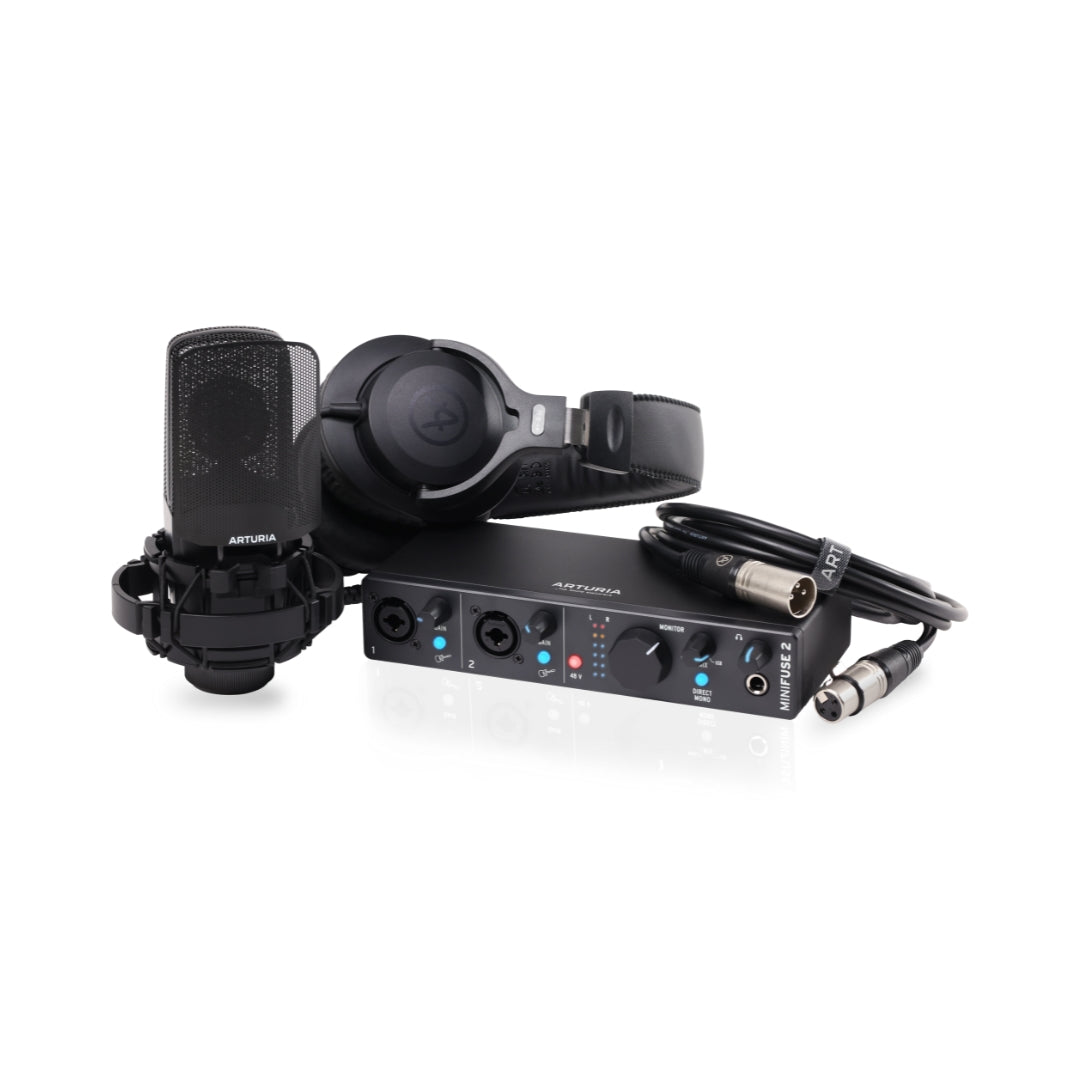 Audio recording setup with microphone, headphones, and audio interface on a white background