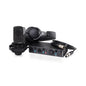 Audio recording setup with microphone, headphones, and audio interface on a white background