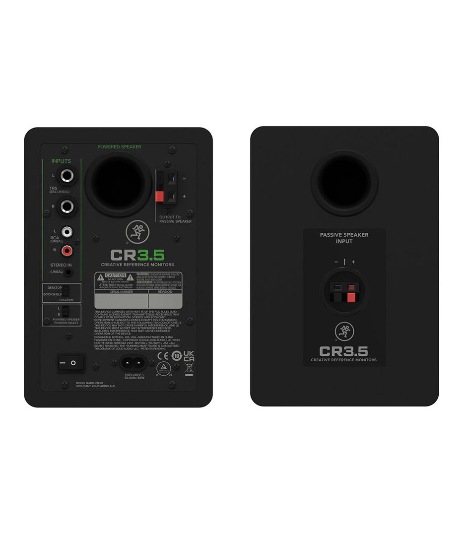 Two black studio monitors with labeled ports on a white background
