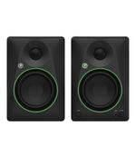 Pair of black studio monitors with green accents on a white background