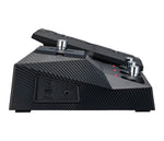 Black guitar effects pedal with carbon fiber texture on a white background