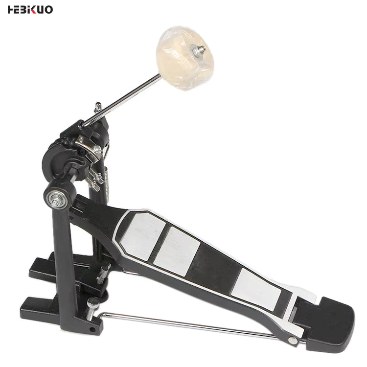 Drum pedal with a white ball on a white background
