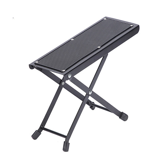 Black metal footstool with mesh surface on a white background