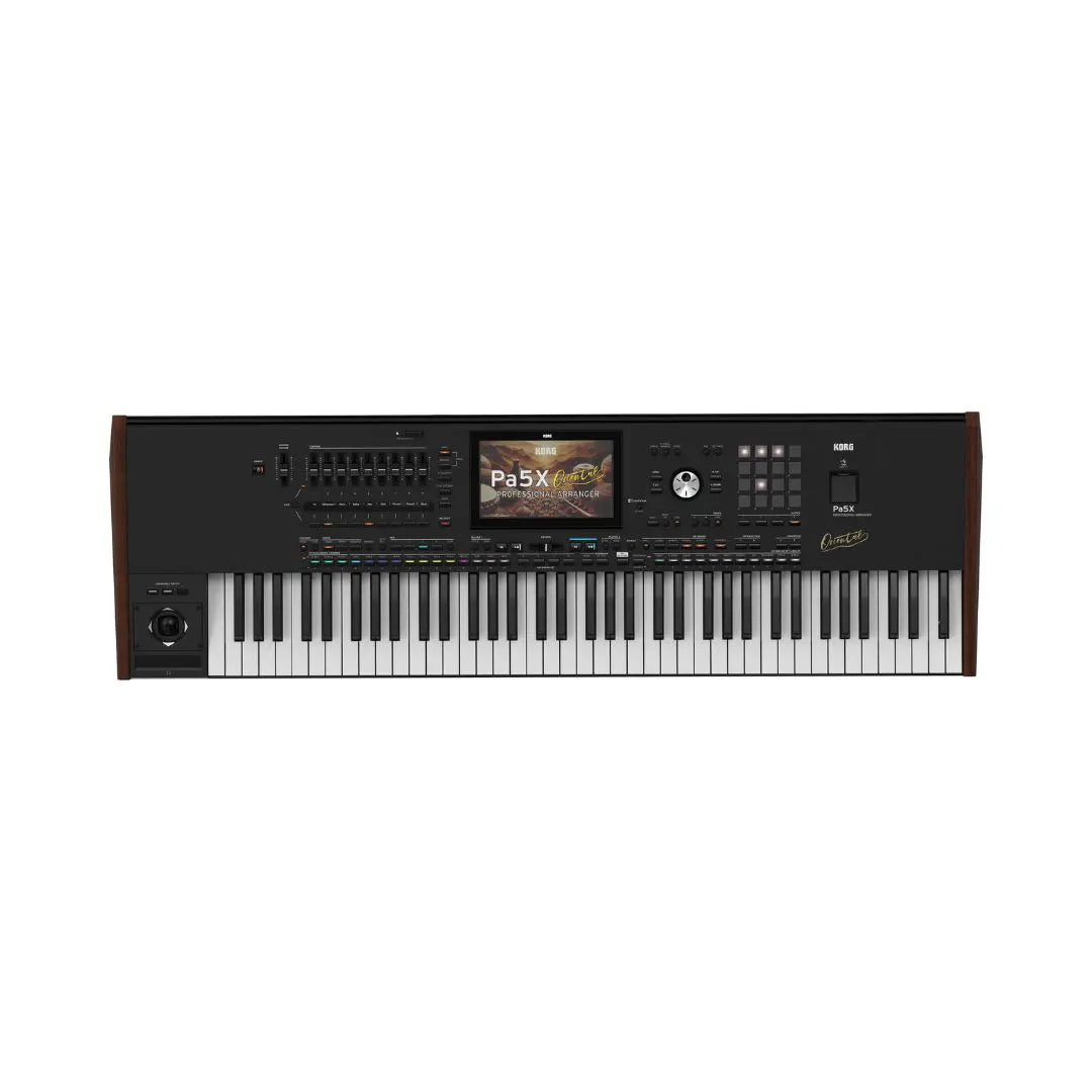 A Casio PX-5000 digital piano shown from the front against a plain white background. The keyboard has black and white keys, a black control panel with a small display screen, and dark brown wood-grain side panels.