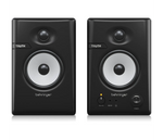 Pair of Behringer Truth studio monitors on a white background