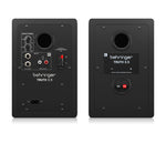 Two Behringer Truth 3.5 studio monitors on a white background