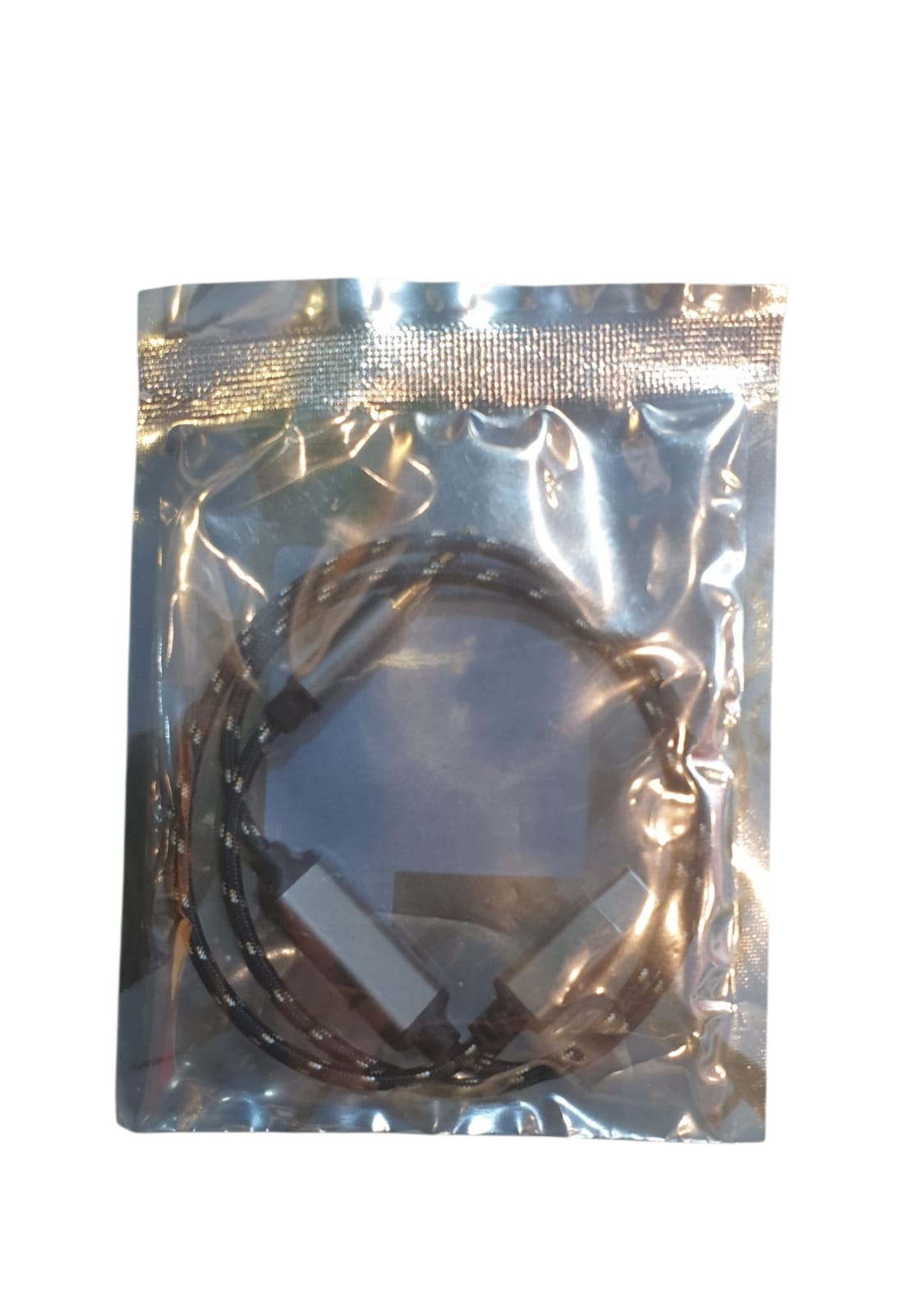 Metallic cable in a clear plastic bag on a white background