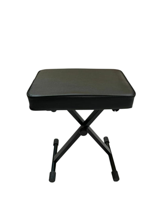 Black folding piano bench on a white background