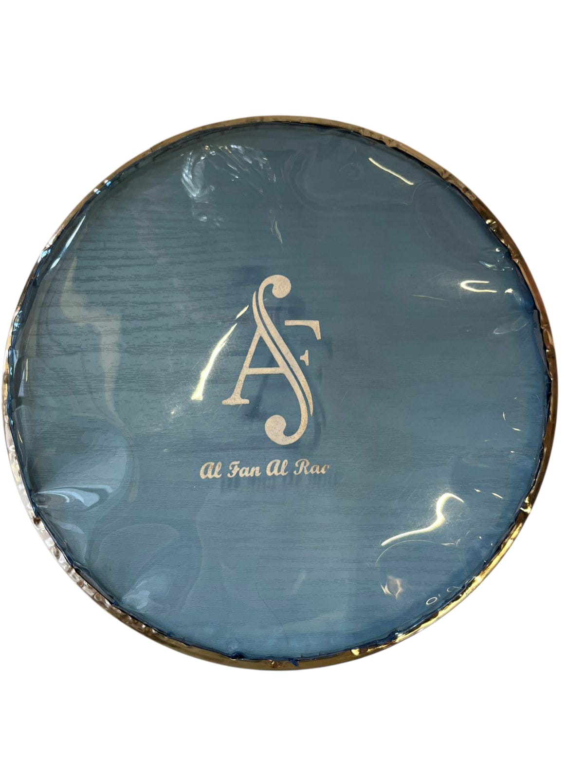 Round blue object with a gold logo and text on a white background