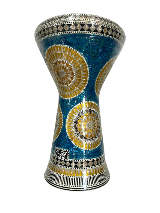 Decorative drum with blue and yellow patterns on a white background