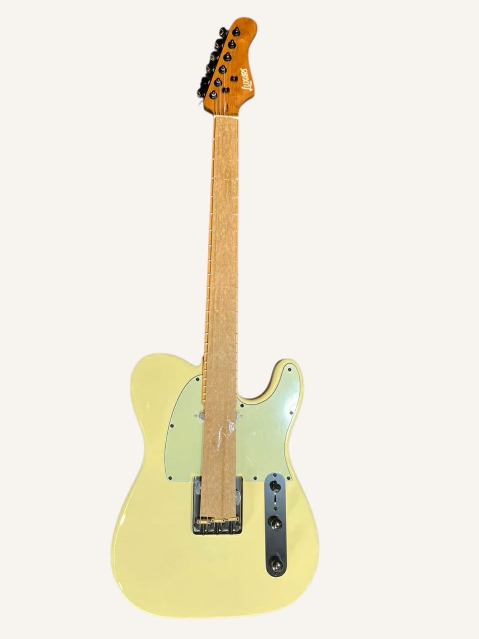 Yellow electric guitar on a white background