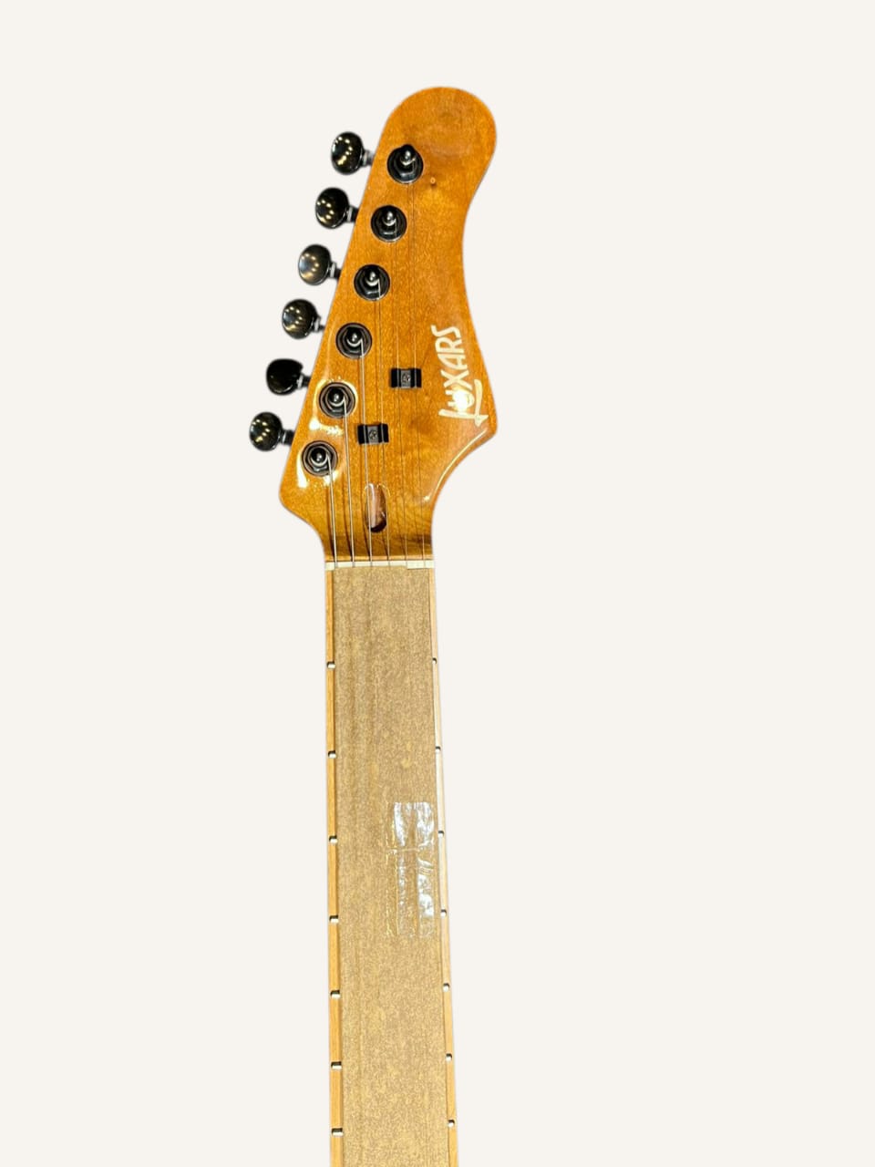 Guitar headstock with brand logo on a white background
