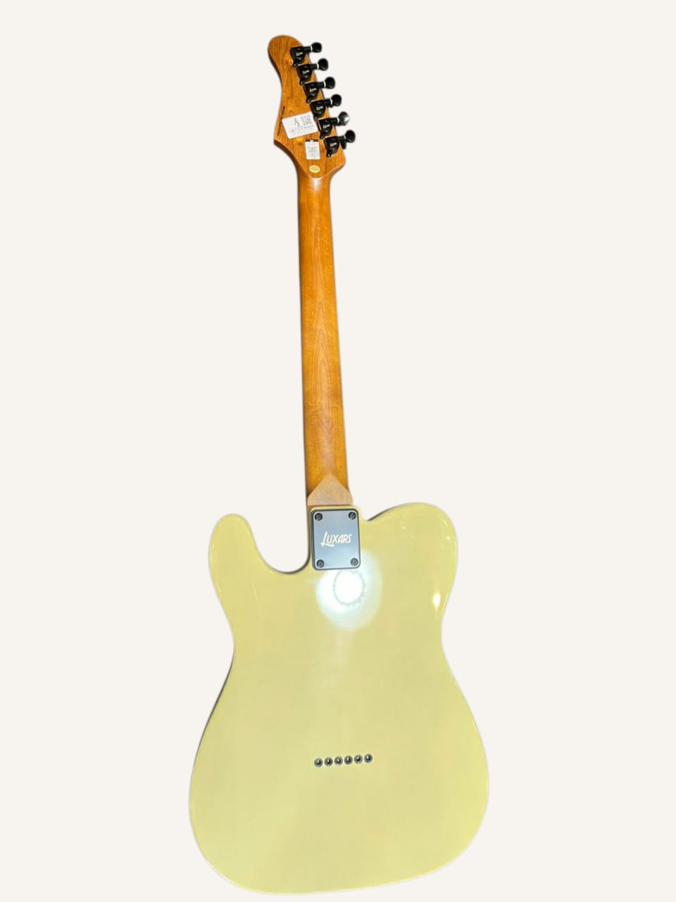 Electric guitar with a light on a white background
