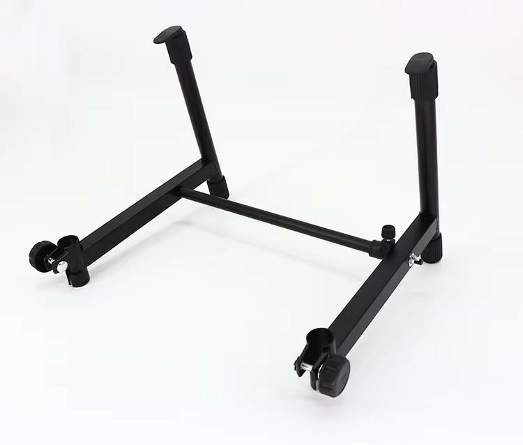 Black adjustable guitar stand on a white background