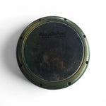 Round metal object with 'K&N' branding on a white background