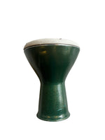 Green darbuka on a white background