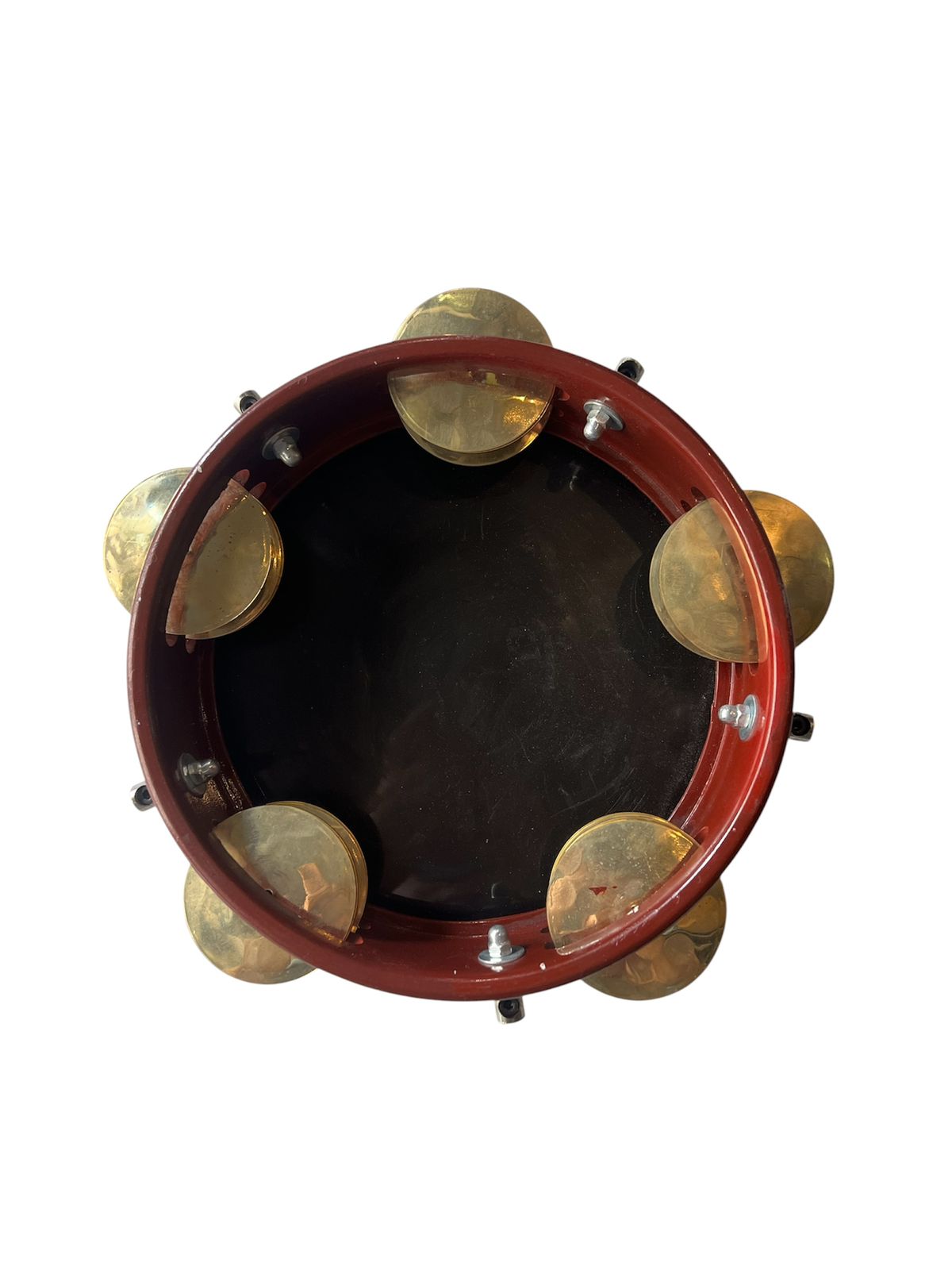 Tambourine with gold jingles on a white background
