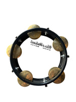Tambourine with metal jingles on a white background