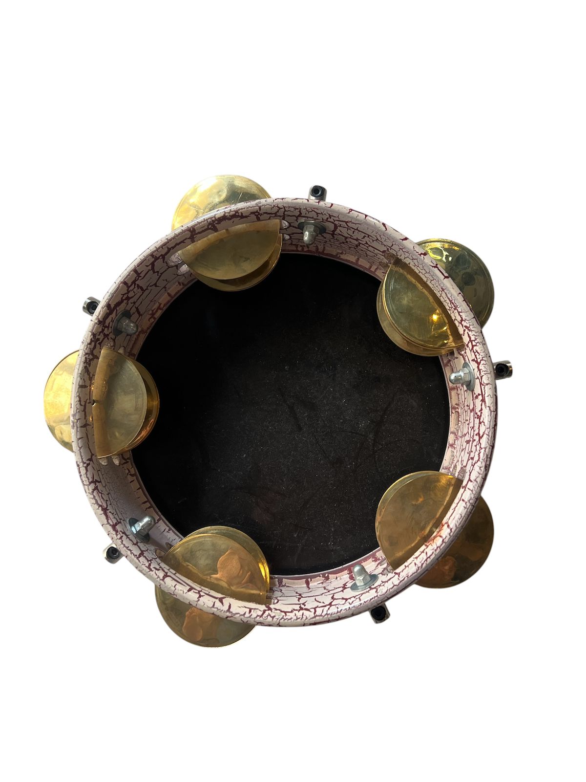 Tambourine with gold jingles on a white background