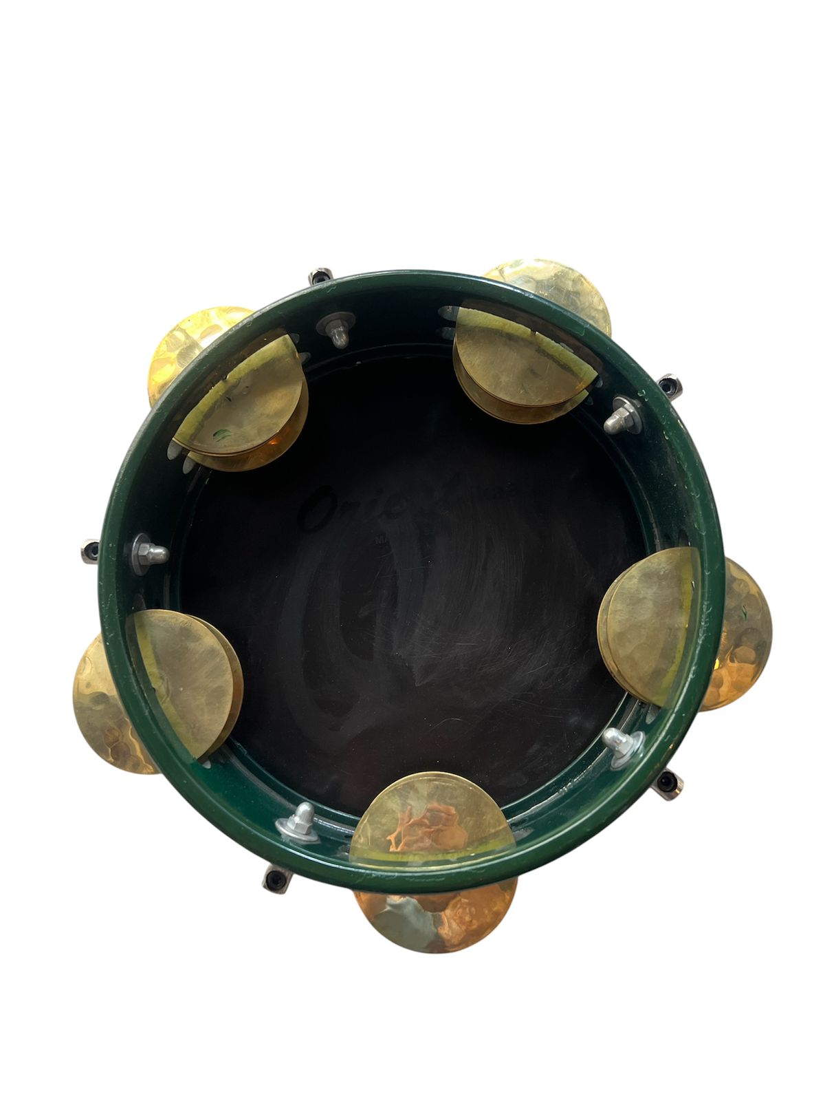 Green tambourine with gold jingles on a white background