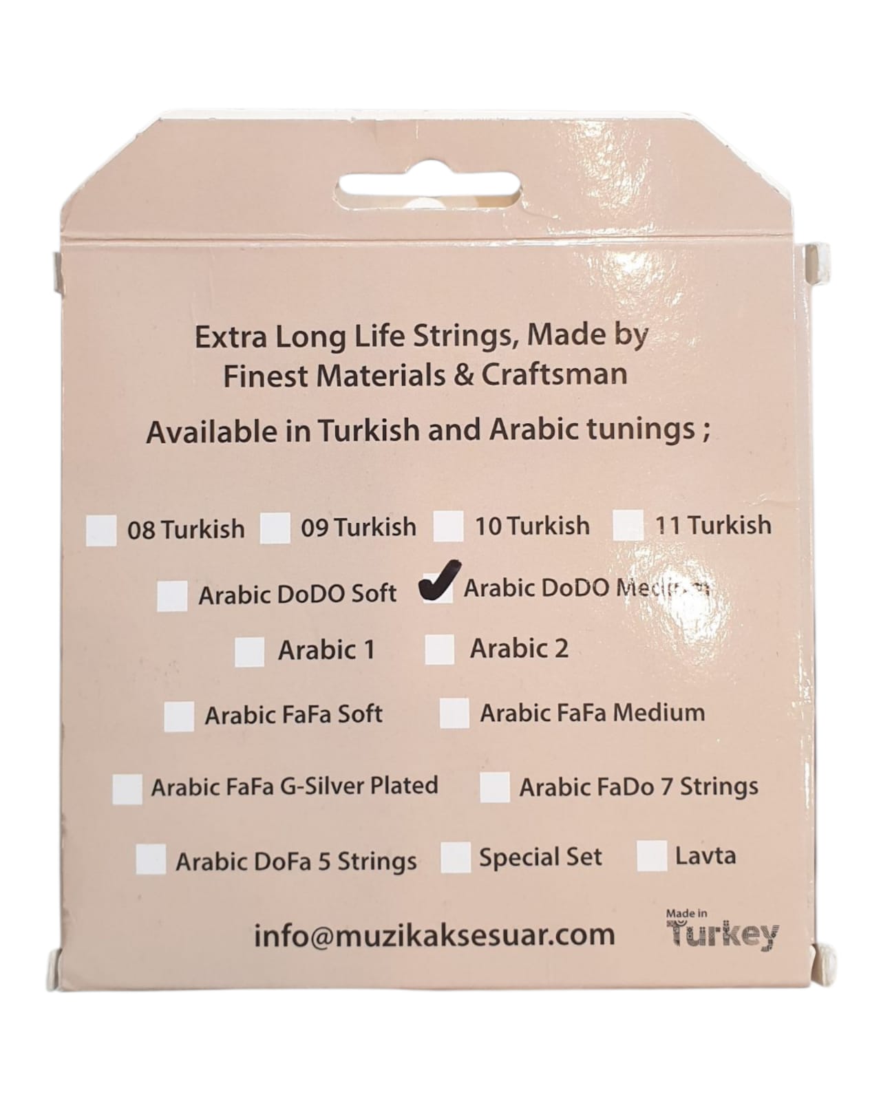 Packaging of guitar strings with tuning options on a beige background