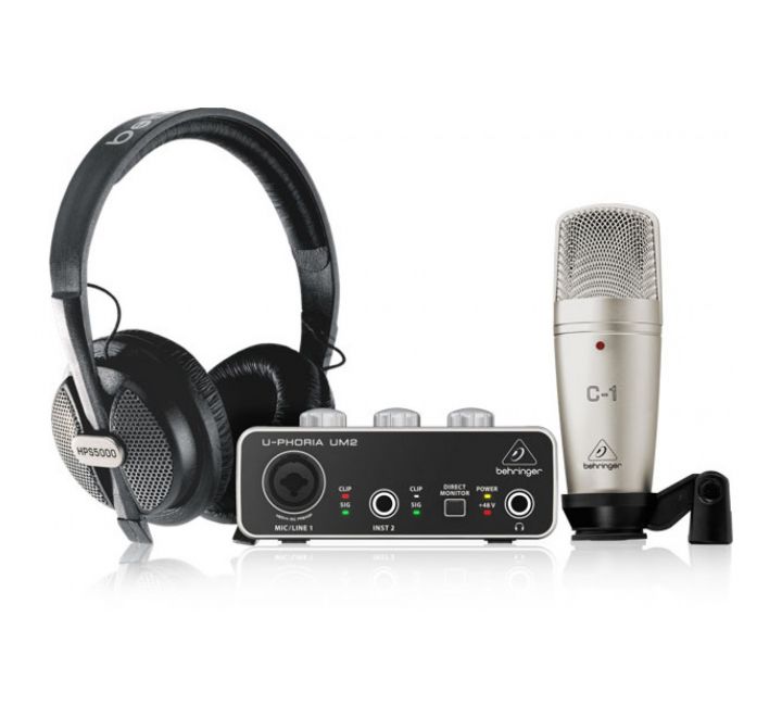 Audio equipment set with headphones, audio interface, and microphone on a white background