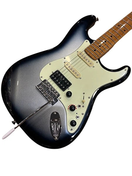 Electric guitar with a silver and black body on a white background