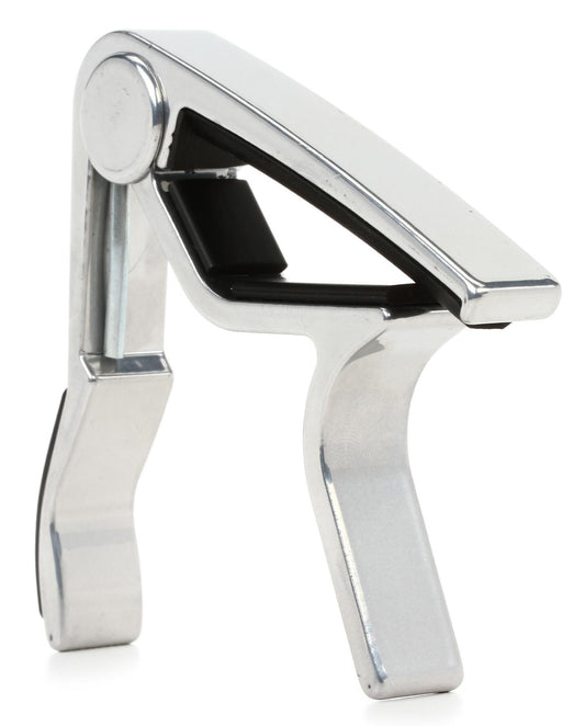 Metallic guitar capo on a white background