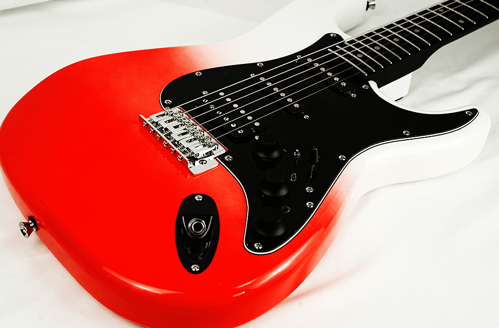 Red electric guitar with a black pickguard on a white background