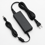 Three-quarter view of the Yamaha PA300C AC power adapter with its attached power cable and connectors.