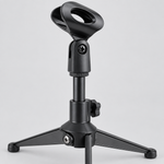 Close detail of the unbranded ZM-07 mini microphone stand showing its microphone clip, adjustment joint, knob, support, and round base
