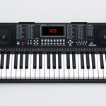 Close detail of the unbranded MK2108 electronic learning keyboard LED display, control panel, speakers, and black and white keys