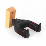 Close detail of the J-19A guitar hanger showing its padded arms, red accents, and mounting structure
