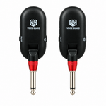 Straight close-up of the Voice Guard QT-7 wireless units showing Voice Guard labels, 1/4-inch-style plugs, power controls, and visible indicators