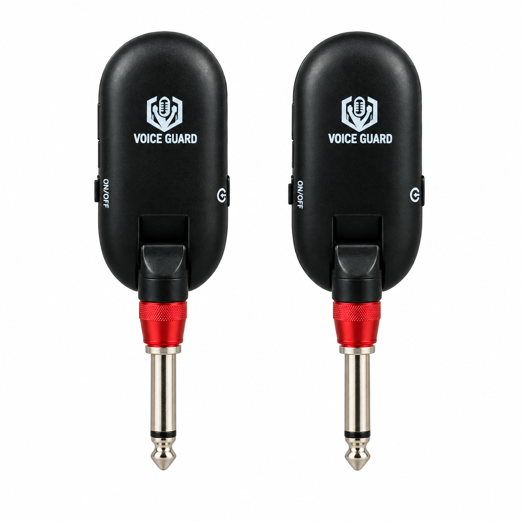 Straight close-up of the Voice Guard QT-7 wireless units showing Voice Guard labels, 1/4-inch-style plugs, power controls, and visible indicators