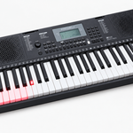Close-up of the Medeli IK100 illuminated keys and LCD control panel.