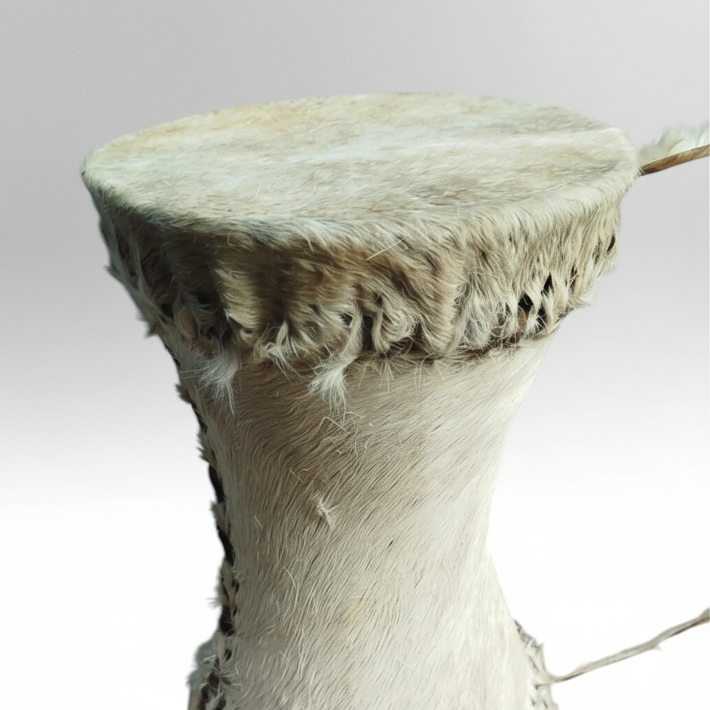 One unbranded African tribal hand drum shown in close detail with its drumhead, rim, textured body, decorative stitching, and hanging cords
