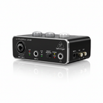 Behringer U-Phoria UM2 black USB audio interface shown at a 45-degree angle with front controls, XLR/TRS input, instrument input, headphone output, and side connections