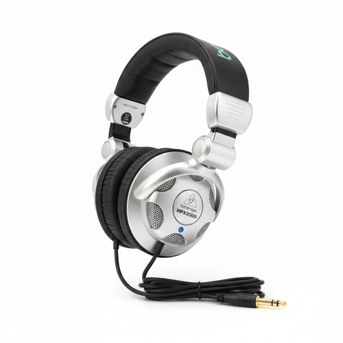 Behringer HPX2000 closed-back DJ headphones shown from the side with adjustable headband, swivel hinge, earcup, and cable visible