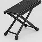 Close detail of the unbranded J-46 guitar footrest textured platform, folding hinge, support frame, and rubber foot