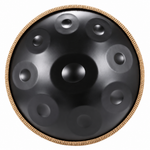 Top view of a black 22-inch steel handpan with raised tone fields and a gold-tone braided rim